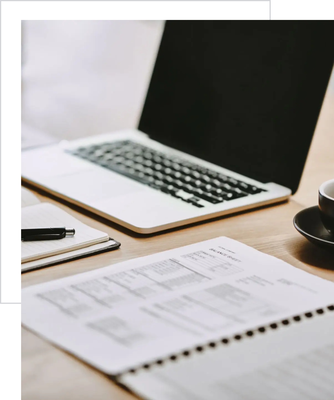 Office desk with notebook and pen